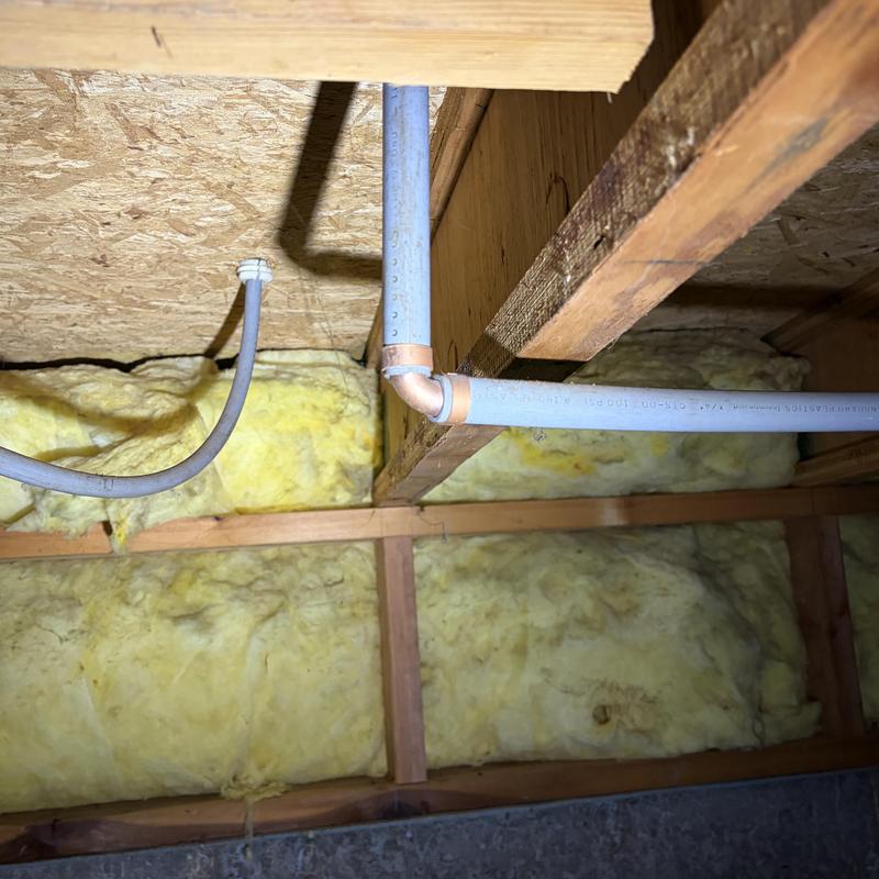 PEX water piping with copper elbow in attic framing PEX water piping with copper elbow in attic framing