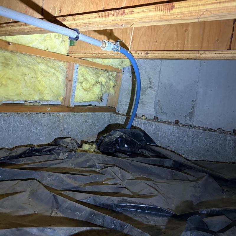 PEX water piping with insulation and crawl space plastic sheeting PEX water piping with insulation and crawl space plastic sheeting