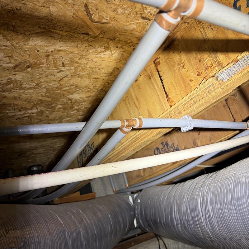 PEX water piping and copper fittings in attic space PEX water piping and copper fittings in attic space