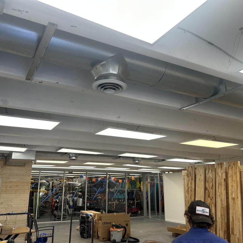 Commercial LED light panels installation in store ceiling Commercial LED light panels installation in store ceiling
