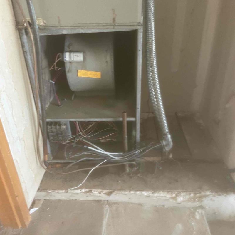 Furnace blower motor and wiring in open cabinet