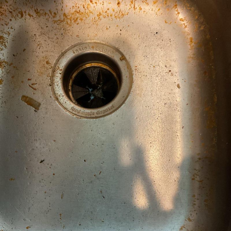 Sink disposal drain with jammed debris buildup