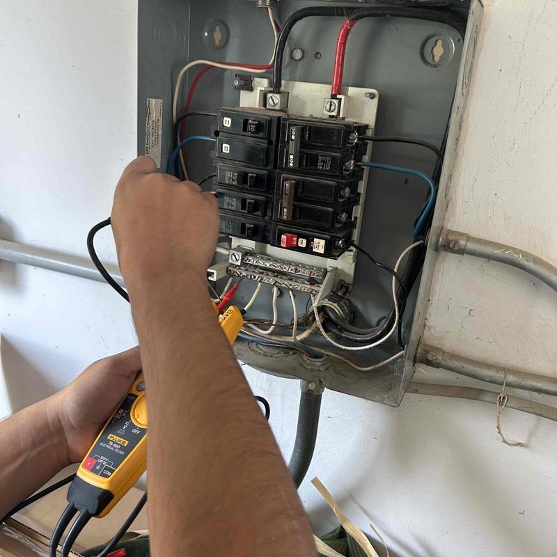 Electrical breaker panel voltage testing with multimeter