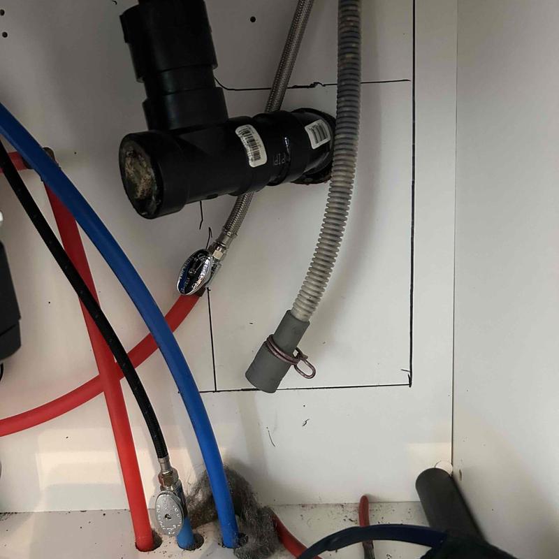 Dishwasher drain pipe and cabinet drywall cutout