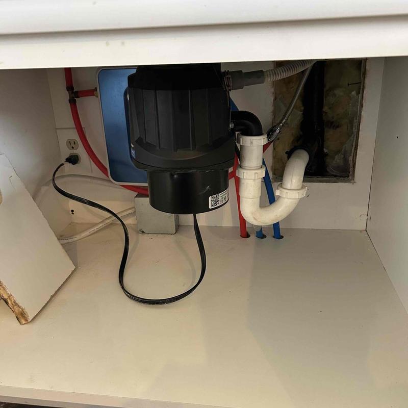 Kitchen sink drain pipe and garbage disposal installation area