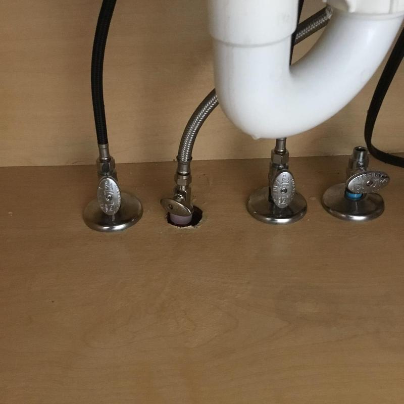 Kitchen sink supply valves and lines under drainpipe