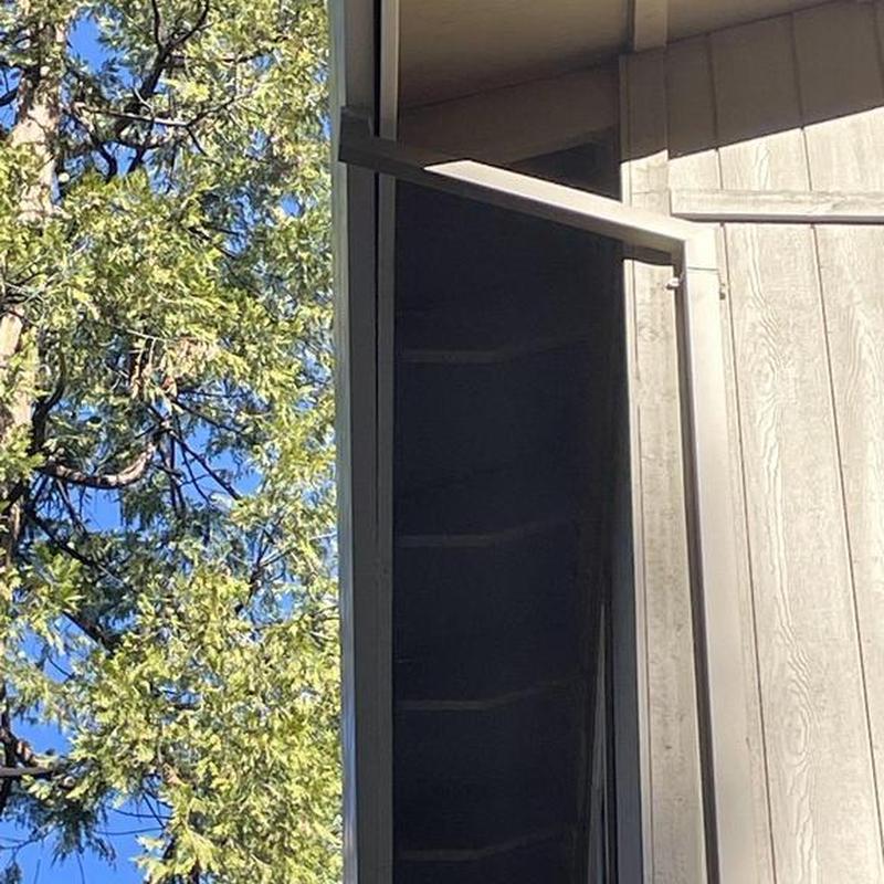Steel seamless gutter with leaf blaster guard on cabin roof