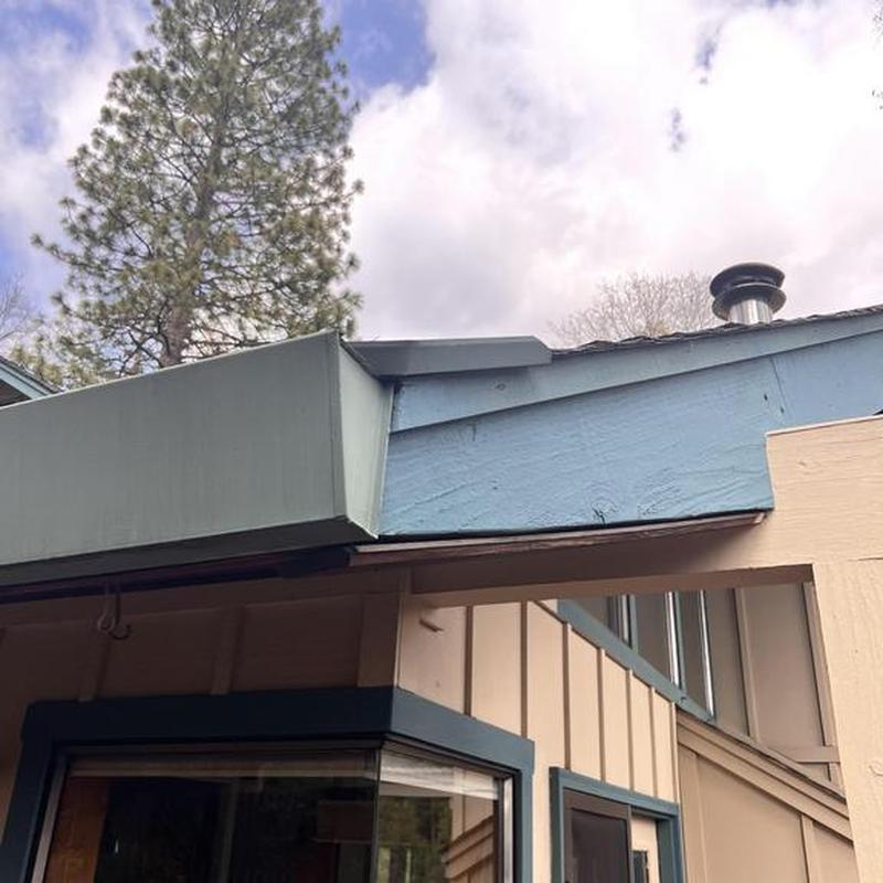Steel seamless gutter and blue fascia installation