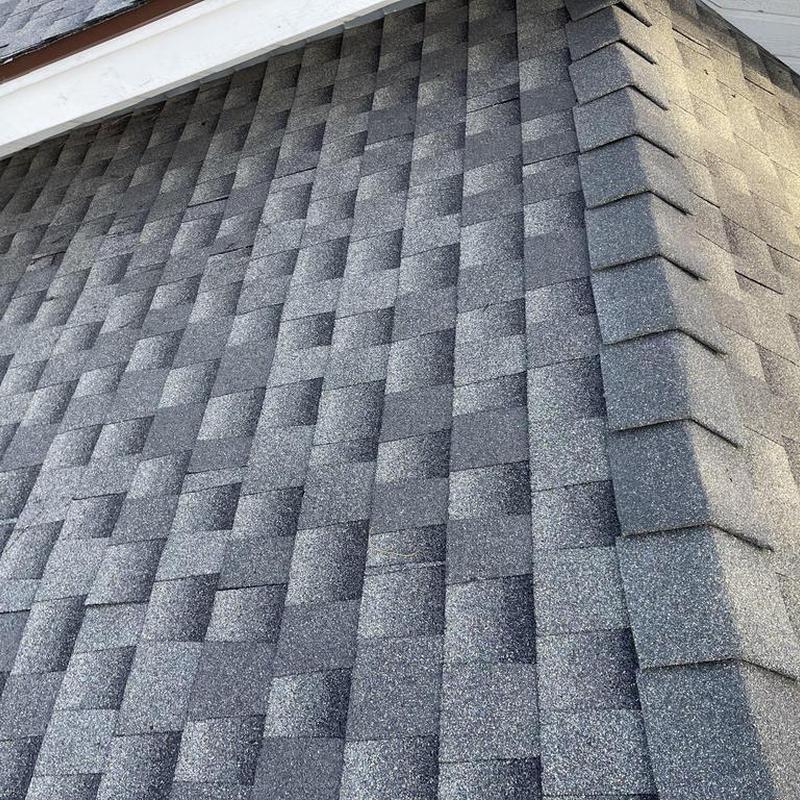 GAF asphalt shingle roof installation on home corner
