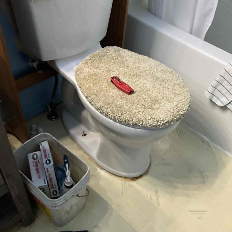 Toilet with new wax seal and hardware installation