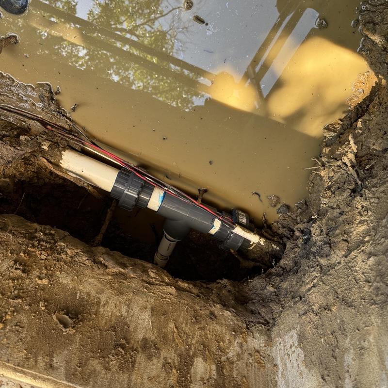 Leaking underground water line with repair fitting