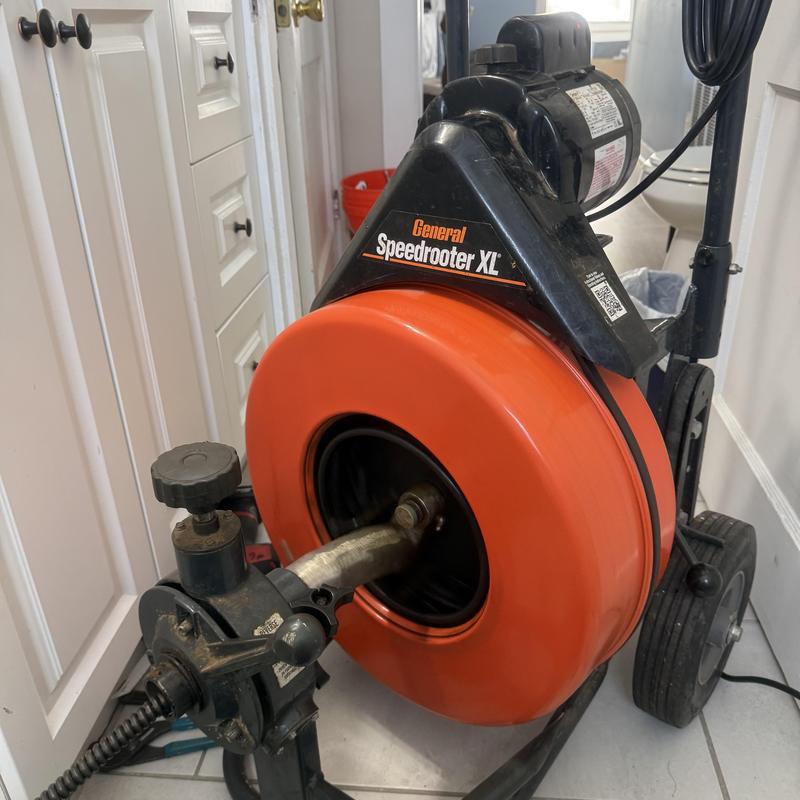 Speedrooter drain cleaning machine in residential bathroom Speedrooter drain cleaning machine in residential bathroom