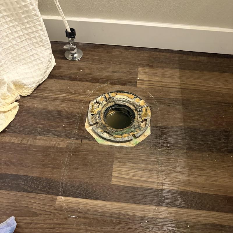 Toilet flange on wood floor before installation Toilet flange on wood floor before installation