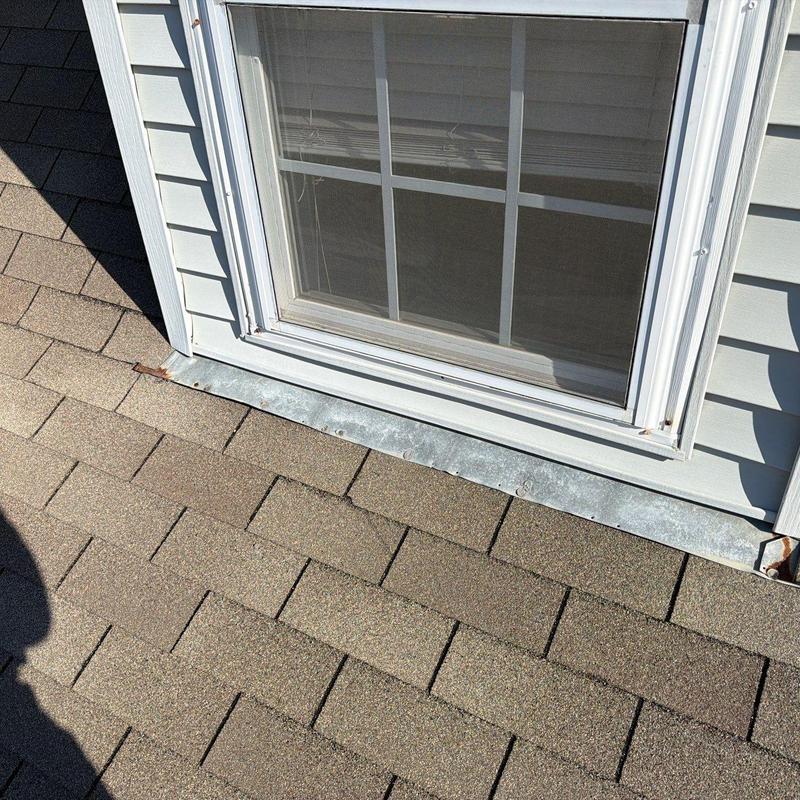 Window flashing and shingle roof inspection near window