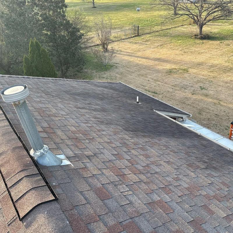 Asphalt shingles roof with vent pipe and edge flashing