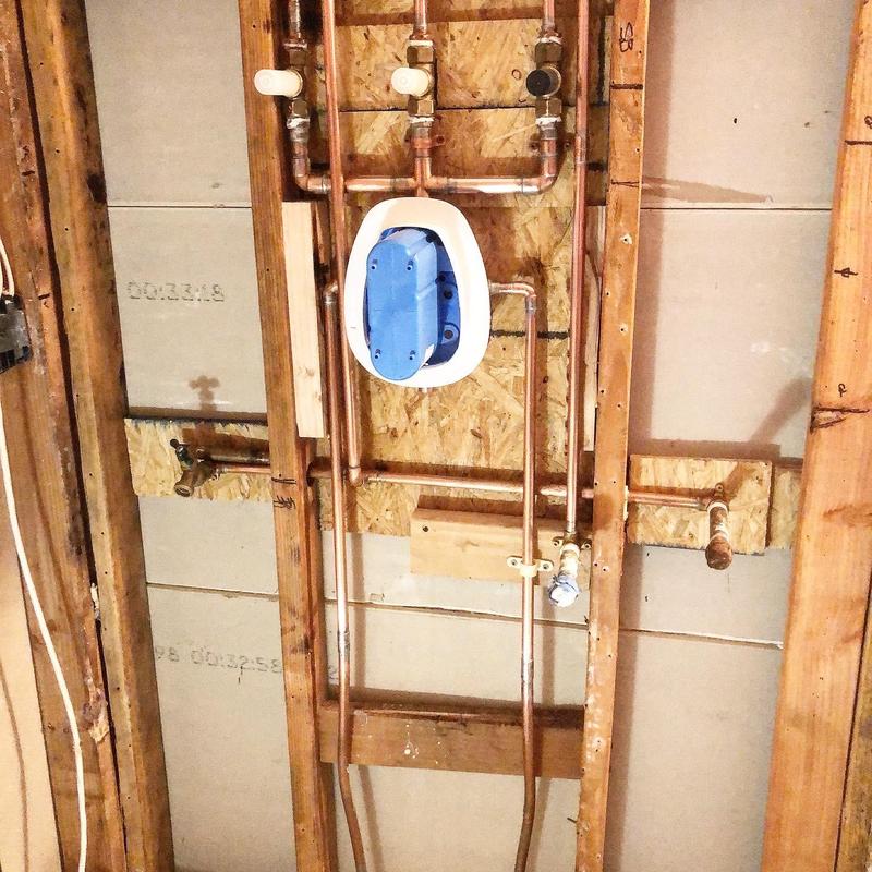 Shower valve rough-in plumbing in wall framing