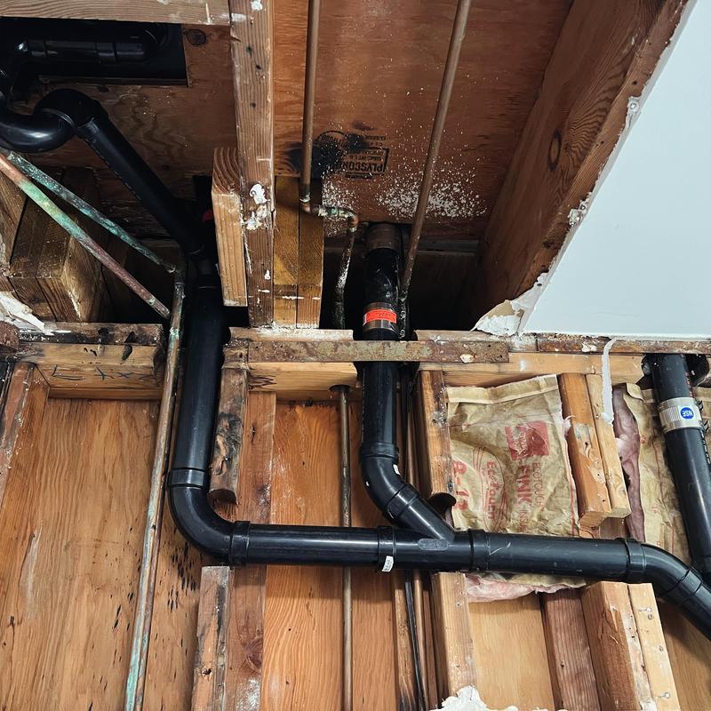 ABS drain pipes installation within ceiling joists