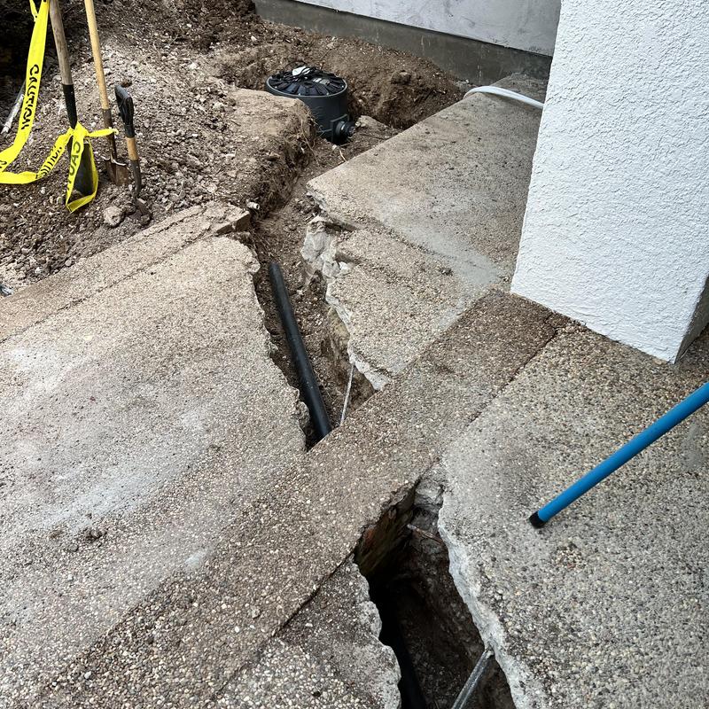 Sewage ejection system trench and sump installation