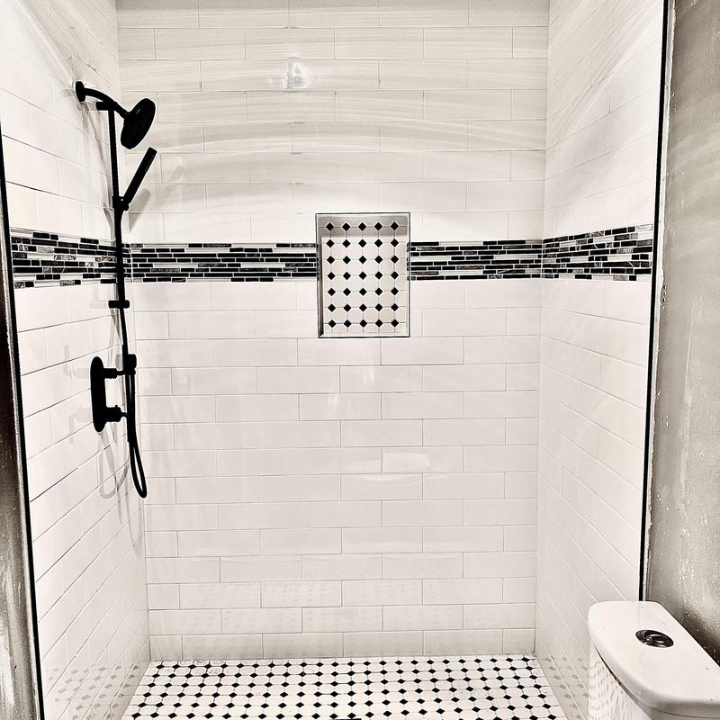 Shower valve and drain installation in tiled shower