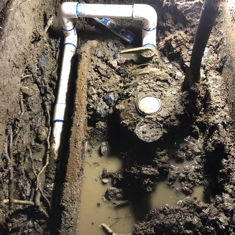 2-inch PVC water main and meter repair in muddy trench