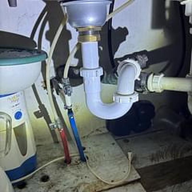 Basket strainer and under-sink drain pipes in kitchen Basket strainer and under-sink drain pipes in kitchen