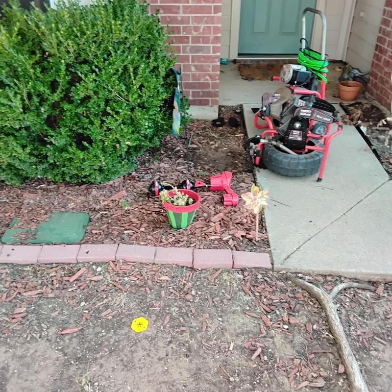 Main sewer line cleanout with drain auger equipment