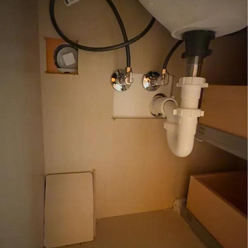Sink plumbing with P-trap and water supply valves installation