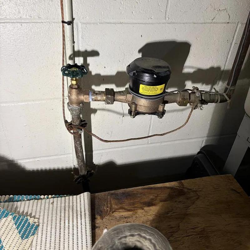 Water meter with shutoff valve on pipe system