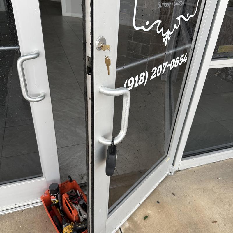 Retail storefront door lock with new rekeyed key Retail storefront door lock with new rekeyed key