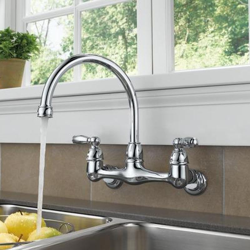 Commercial kitchen faucet with flowing water