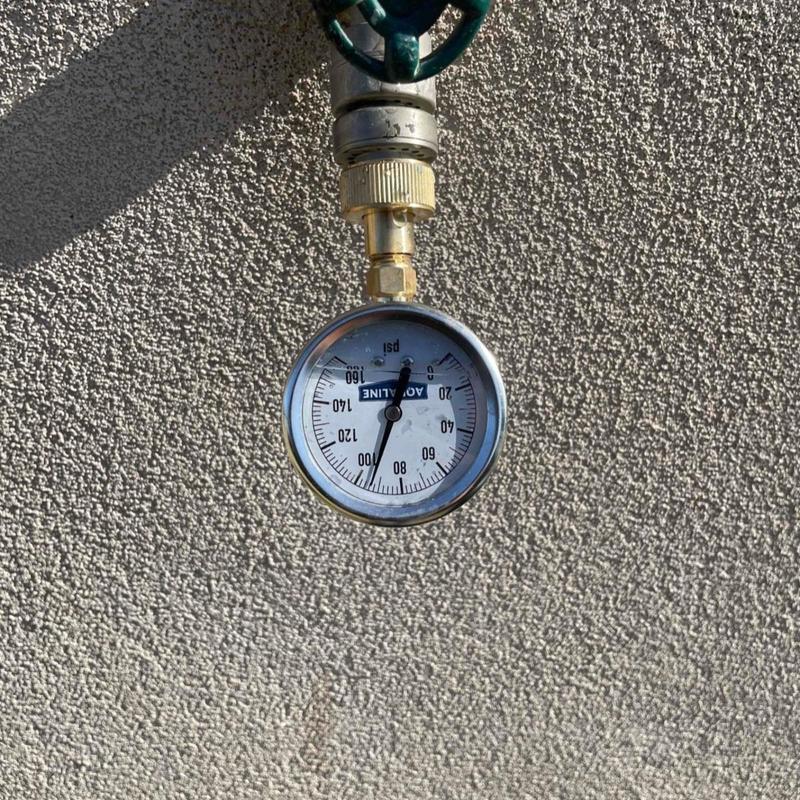 Water pressure gauge on outdoor valve at 93 psi