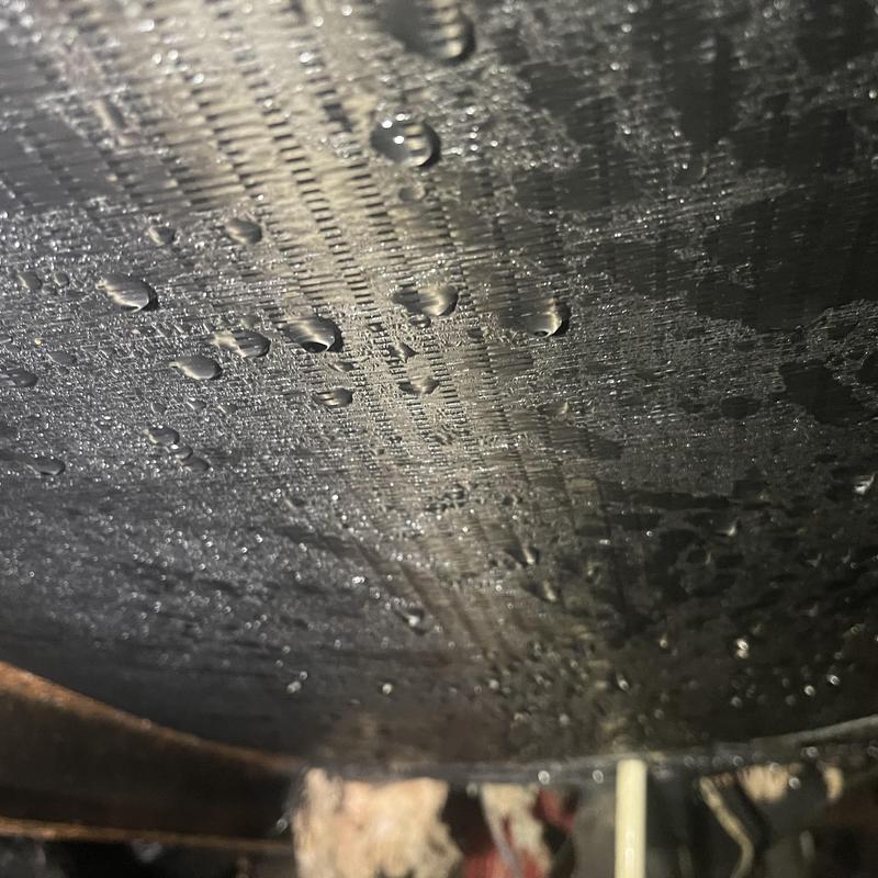 Duct system insulation with condensation droplets beneath residence