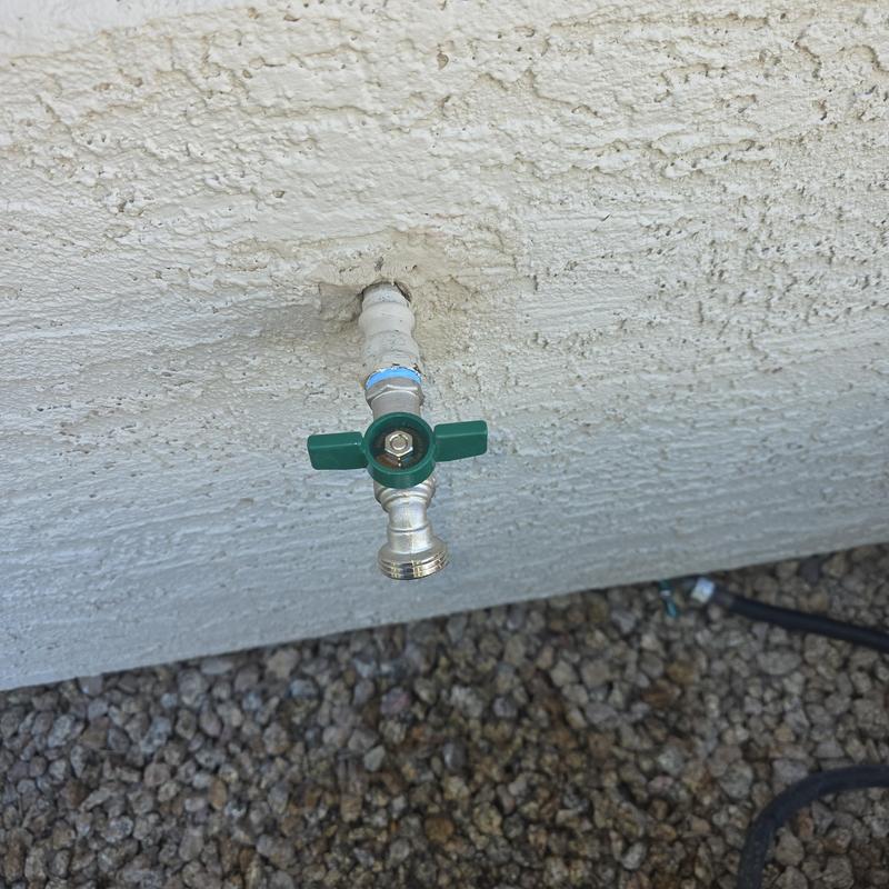 Stainless steel hose bib with green valve handle