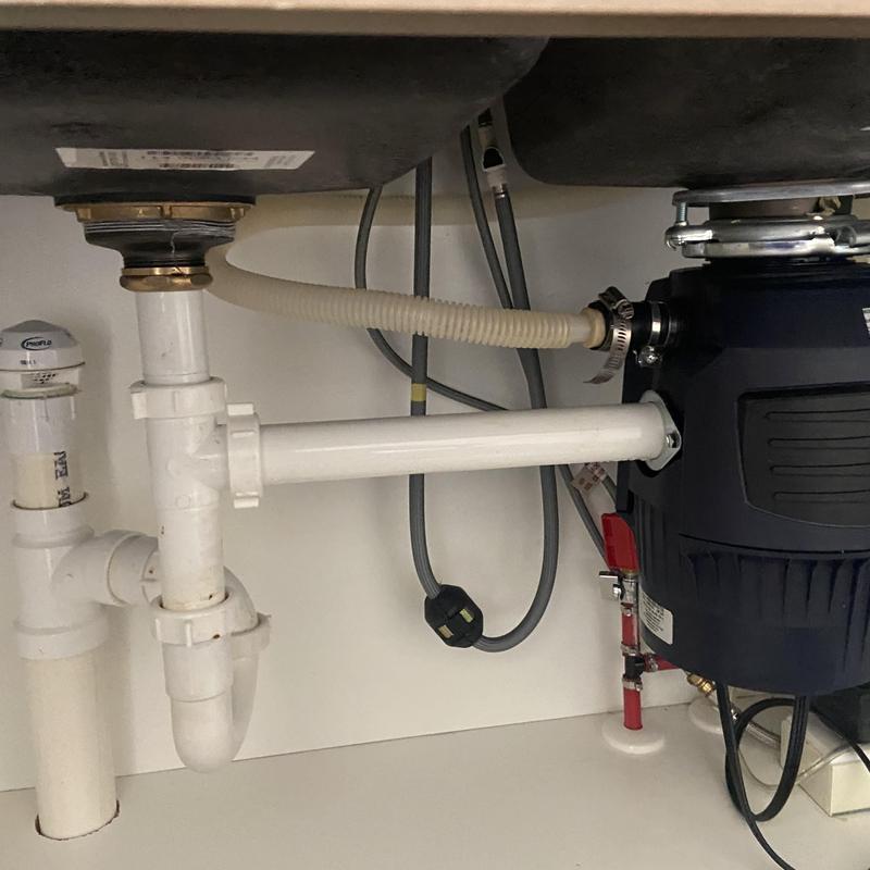 Kitchen sink drain and garbage disposal setup under cabinet Kitchen sink drain and garbage disposal setup under cabinet