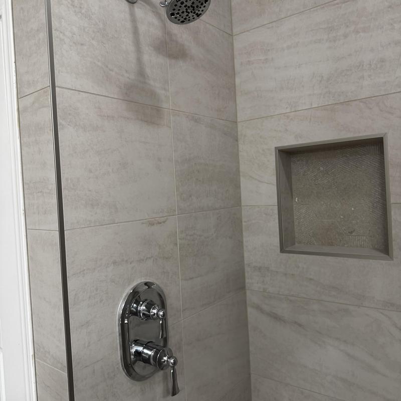 Moen shower trim and showerhead in tiled shower niche Moen shower trim and showerhead in tiled shower niche