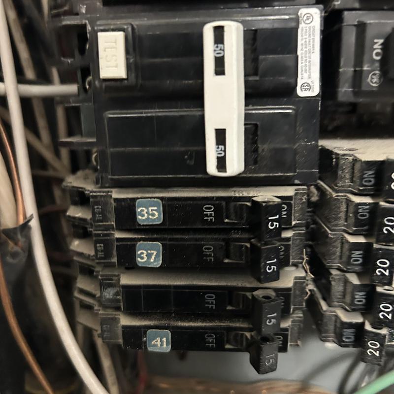 Circuit breakers panel with multiple switches and labels Circuit breakers panel with multiple switches and labels