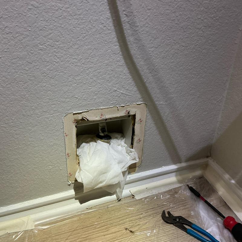 Ice maker box with new PEX line install tools nearby