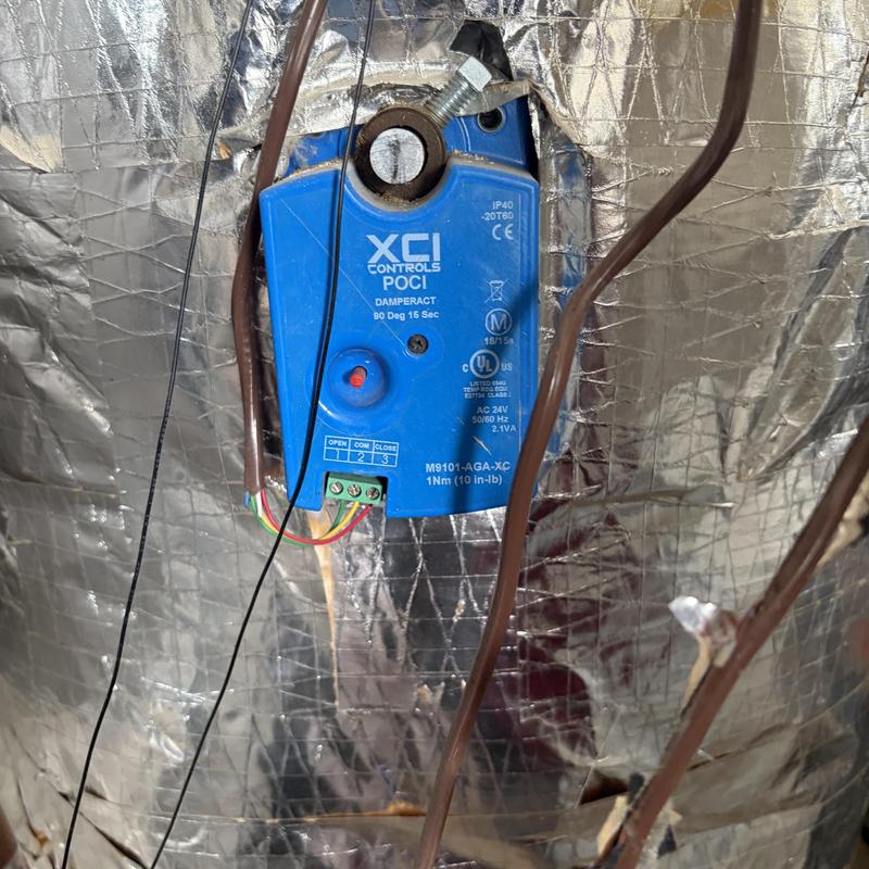 Dampper actuator on HVAC duct insulation panel Dampper actuator on HVAC duct insulation panel