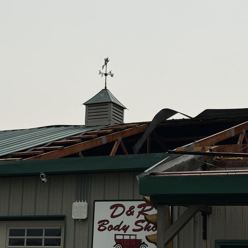 Barn metal roof with structural damage and missing panels Barn metal roof with structural damage and missing panels