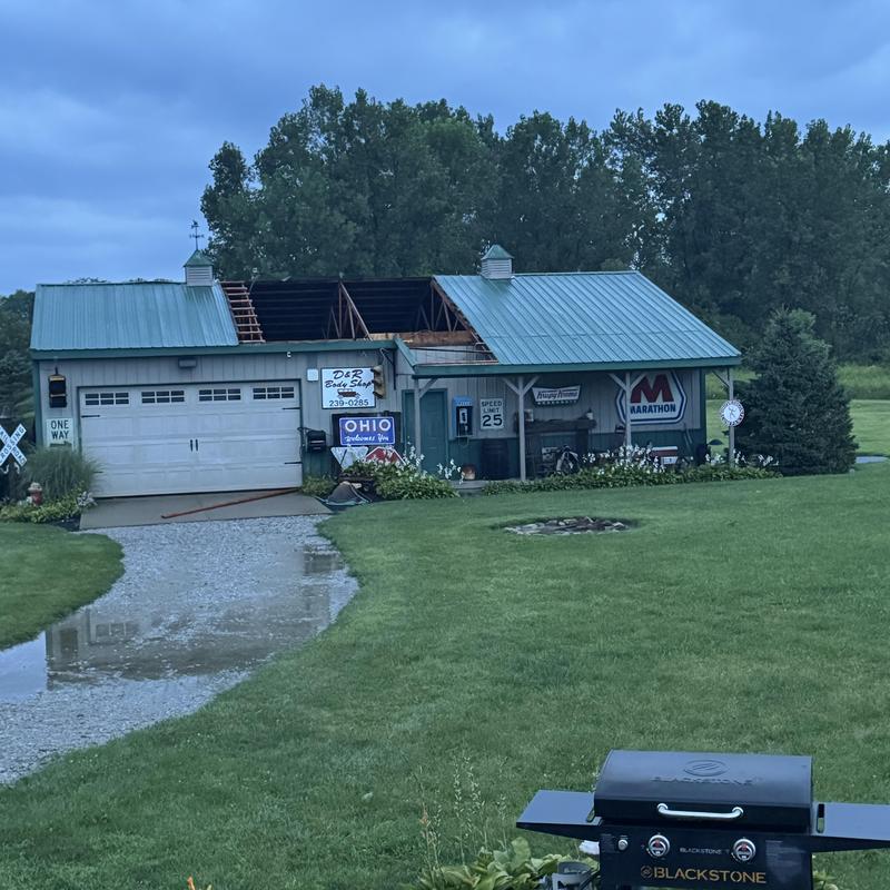 Barn metal roof with severe storm damage and missing panels Barn metal roof with severe storm damage and missing panels
