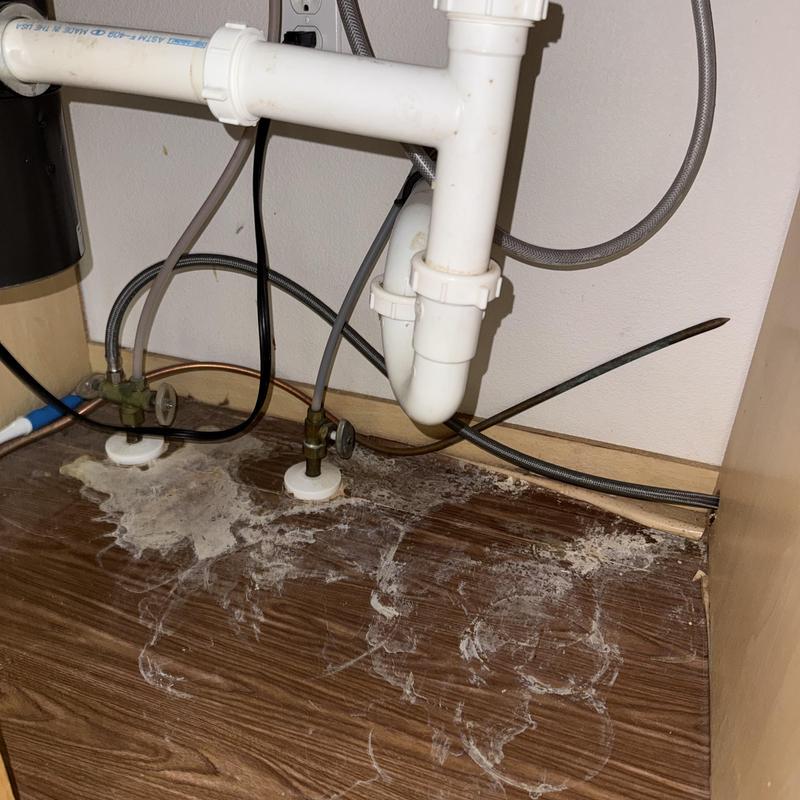 Kitchen sink supply line leak with water damage under cabinet Kitchen sink supply line leak with water damage under cabinet