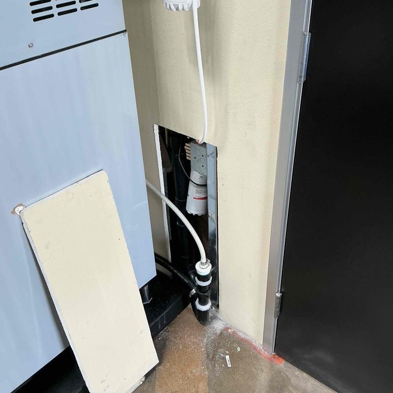 Ice maker water supply line installation near panel