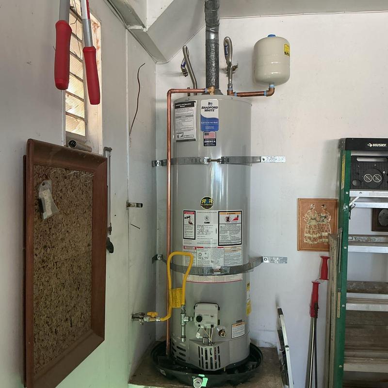 Water heater with new gas line and sediment trap installation