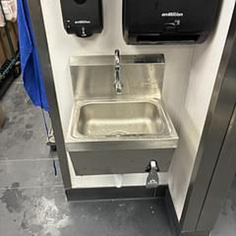 Wall-mounted stainless hand sink with foot pedal Wall-mounted stainless hand sink with foot pedal