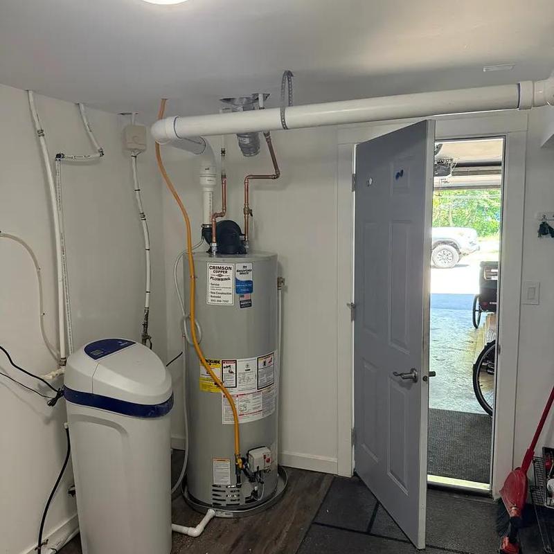 Power vent water heater installation with vent pipe system