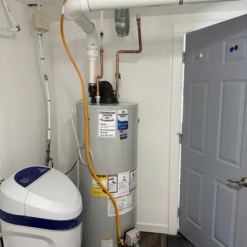 Power vent water heater with copper piping installation