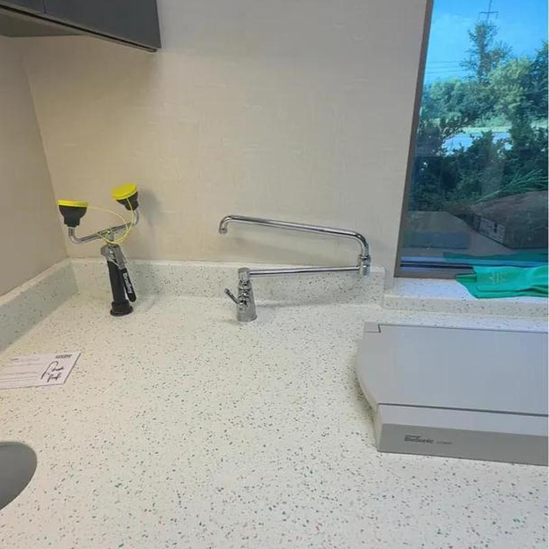 Commercial faucet with long swivel spout on countertop