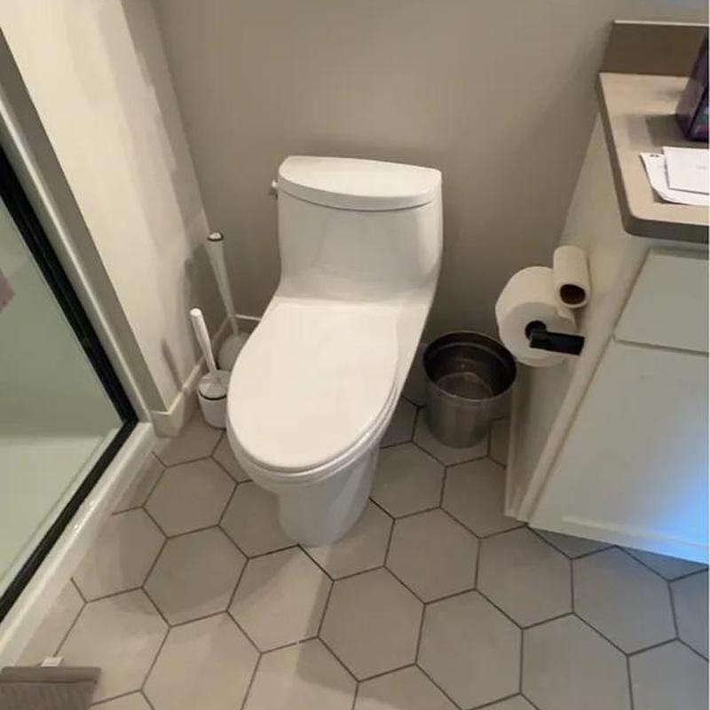 Toilet installation in small bathroom corner