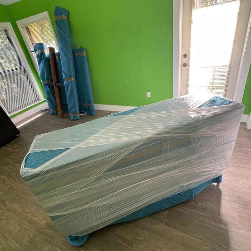 Upholstered chair wrapped for moving in Fort Myers