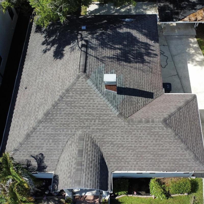 Asphalt shingle roof with chimney and vent system